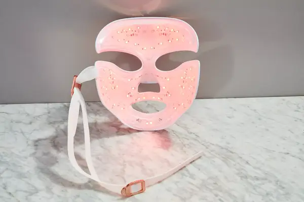 The Dr. Dennis Gross DRx SpectraLite FaceWare Pro is seen on the red light setting