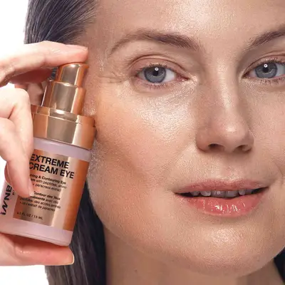 model applying InnBeauty Extreme Cream Eye Cream