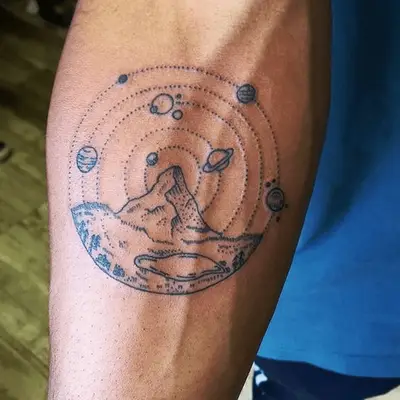 tattoo of a mountain and space