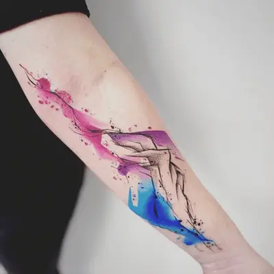 abstract and colorful watercolor mountain tattoo