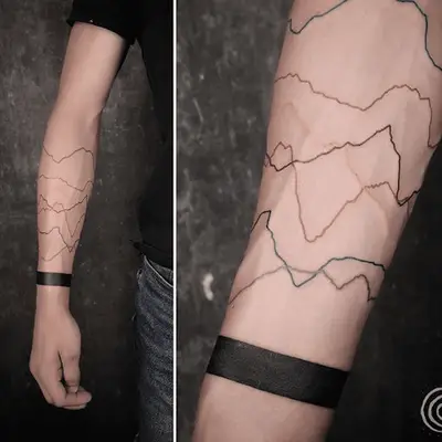 lines tattoo of a mountain in varying colors
