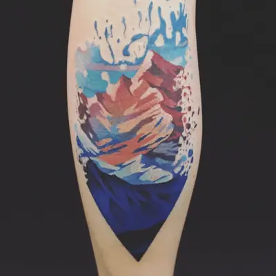 splatter paint design tattoo of a mountain