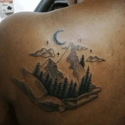 mountain tattoo on someone