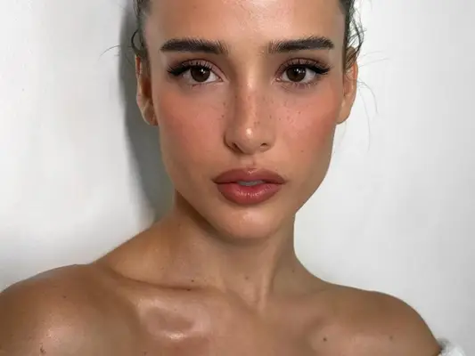 woman with shimmery body oil