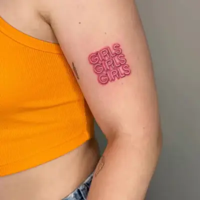 Close-up of arm with pink neon sign-inspired 