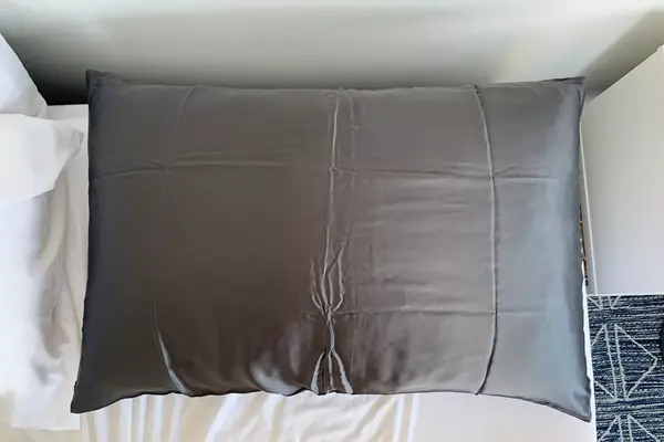 Slpbaby Silk Pillow Case on a bed
