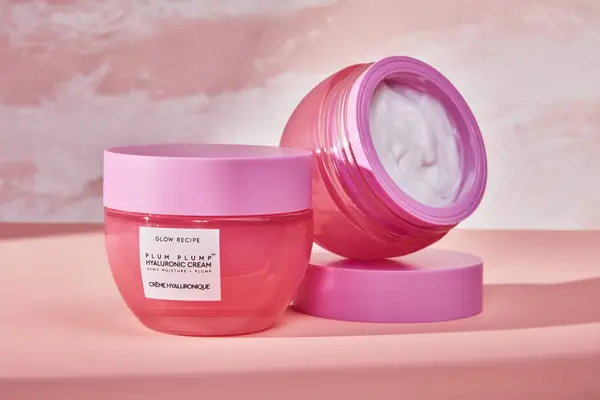 Glow Recipe Plum Plump Hyaluronic Cream displayed on a pink surface