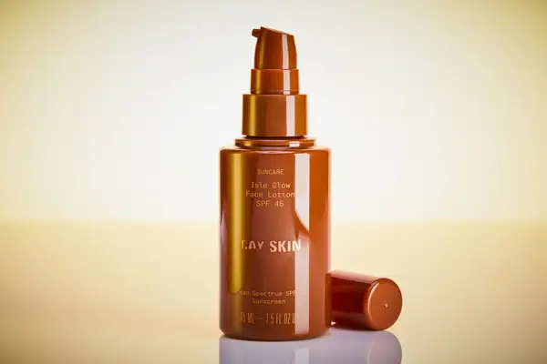 Cay Skin Isle Glow Face Moisturizer SPF 45 on a yellow background