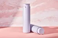 Two Fenty Skin Hydra Vizor Invisible Moisturizer Broad Spectrum SPF 30 Sunscreen with Niacinamide on a pink background