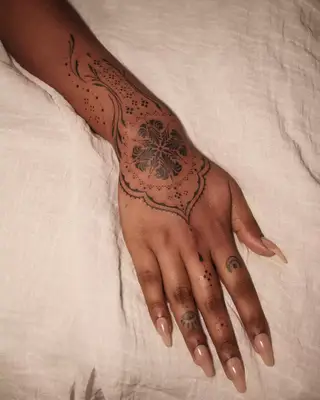 Mandala hand tattoo