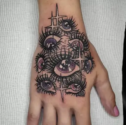 Red and green flower finger tattoos