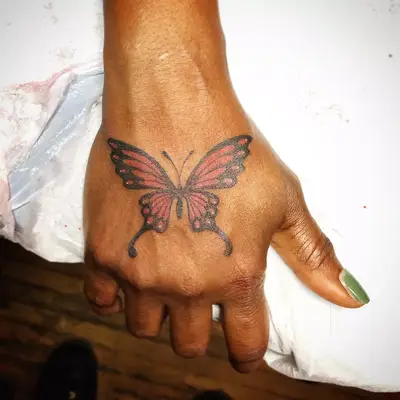 Butterfly hand tattoo