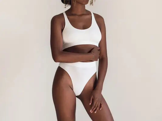 Woman with a white matching underwear set