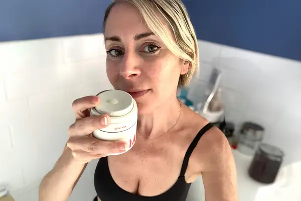 Jill holding product in her hand