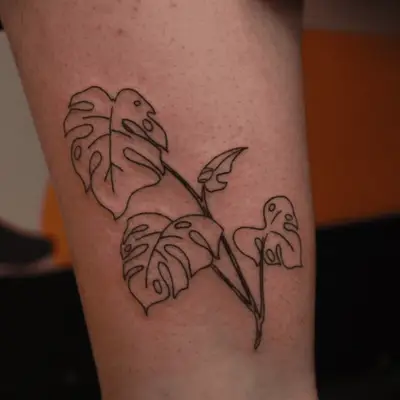 custom tattoo of montera plant on outer leg