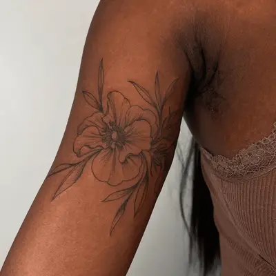 orchid tattoo on inner upper arm