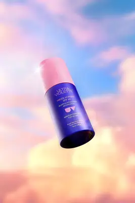 Ultra Violette Preen Screen against a warm sky background.