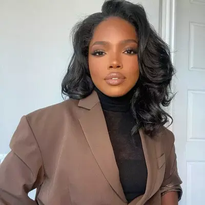Ryan Destiny in a brown jacket