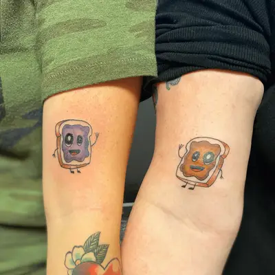 Peanut butter and jelly tattoos on two people