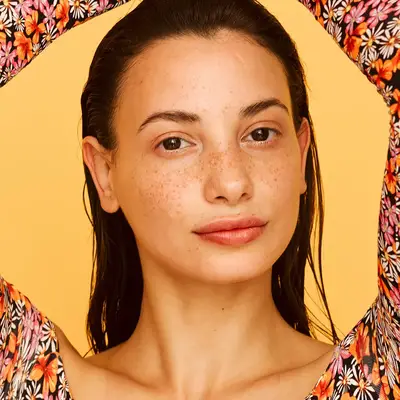 Closeup of person with clear skin and freckles