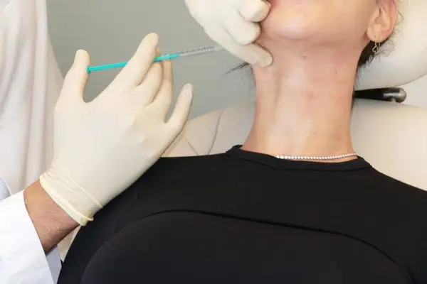 Tanya Akin getting neck Botox injections