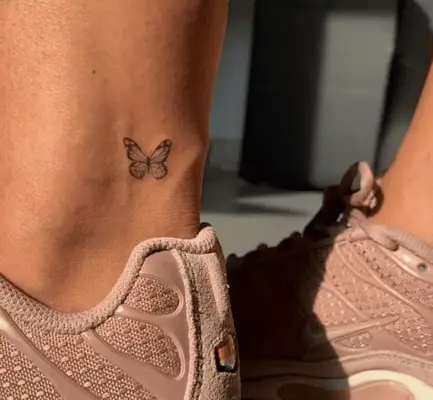 Close up of a butterfly tattoo on an ankle