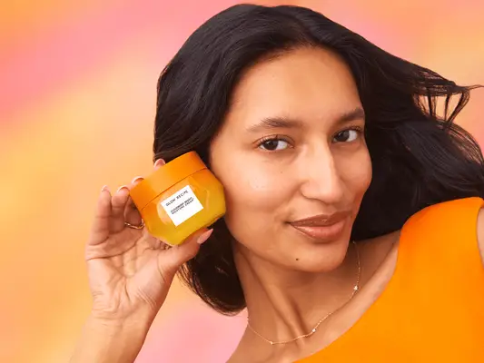 model holding Glow Recipe Cloudberry Moisture Bright Cream