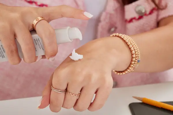 Hand displaying a small amount of Shani Darden Skin Care Weightless Oil-Free Moisturizer