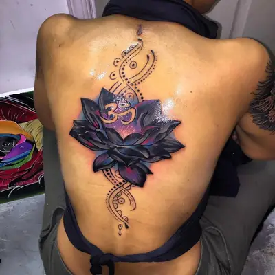 Image of a colorful lotus tattoo design taking up a person