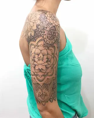 Image of a blackwork lotus flower tattoo design on the arm