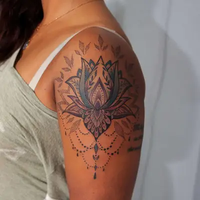 Image of a mult-style lotus tattoo on someone