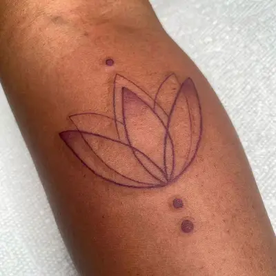 A mulberry lotus flower tattoo