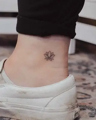 A triangle lotus flower tattoo