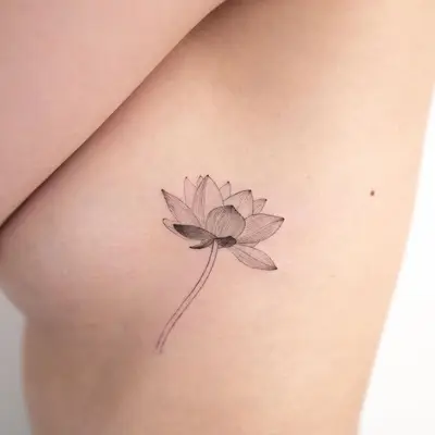 A thin-lined lotus flower tattoo