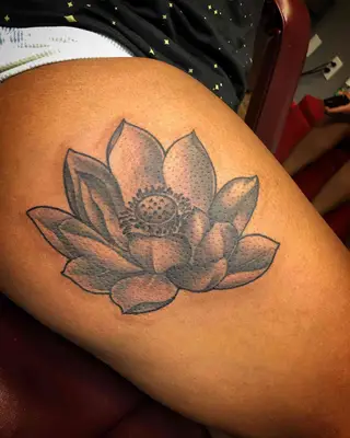 Image of a bold-lined lotus flower tattoo