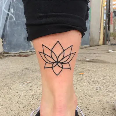 Image of a minimal lotus flower tattoo design above the ankle