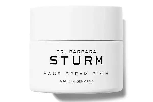 Person rubbing Drunk Elephant Lala Retro Whipped Refillable Moisturizer with Ceramides into their cheek