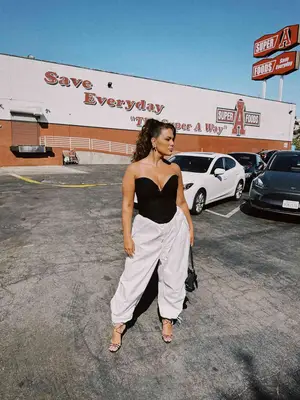 Photo of person wearing a pink shaggy coat 