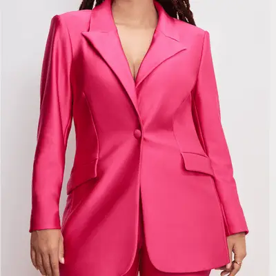 Photo of person wearing a hot pink blazer 