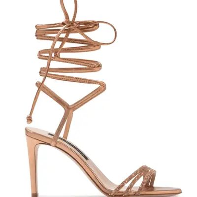 Photo of golden brown high-heeled sandal