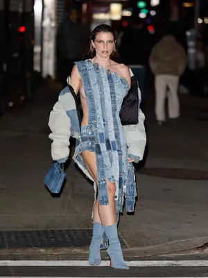 Julia Fox wearing a denim waistband dress