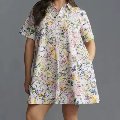 Woman wearing pale ivory sundress, cat eye sunglasses, and woven Miu Miu handbag on Amalfi coast