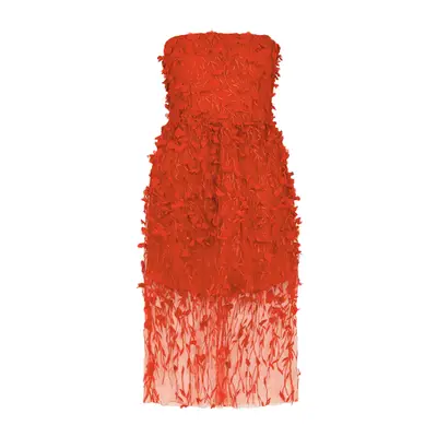 Abisola Omole wears a voluminous tiered baby blue puff-sleeve dress, suede handbag, round sunglasses, and kitten heel slingbacks