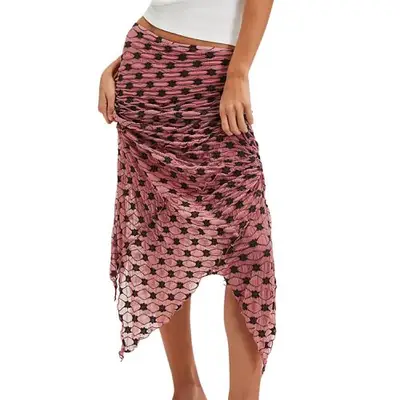 Model wearing a pink printed mesh skirt with asymmetrical hem