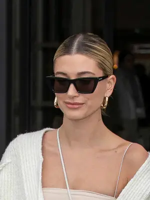 Hailey Bieber wearing black oversized sunglasses