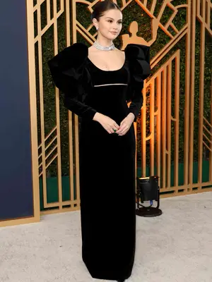 Selena Gomez wears a black puff-sleeve Oscar de la Renta gown and diamond jewelry to the 2022 SAG Awards