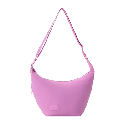 Woman wearing white puff-sleeve top and orange blossom-inspired jewelry by water