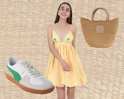 Green, gray, and white Puma Palermo sneakers, woman wearing yellow mini dress, and Brother Vellies woven handbag