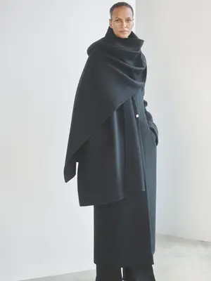 Woman wearing gray scarf coat outfit