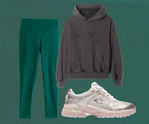 Black Wicked sweatshirt, green leggings, and Coach metallic sneakers with pink accents